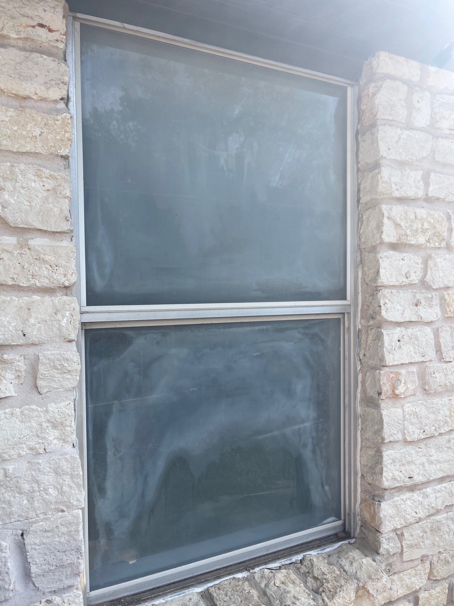 Fogged dual-pane window before glass replacement